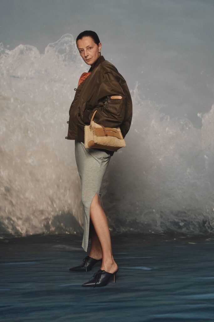 Image may contain Clothing Pants Accessories Bag Handbag Coat Jacket Adult Person Footwear High Heel and Shoe