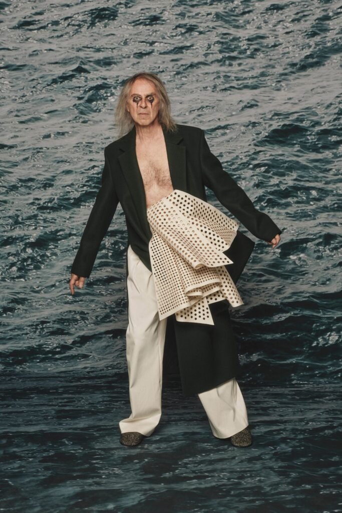 Image may contain Clothing Coat Blazer Jacket Pants Formal Wear Suit Adult Person Blonde Hair Face and Head