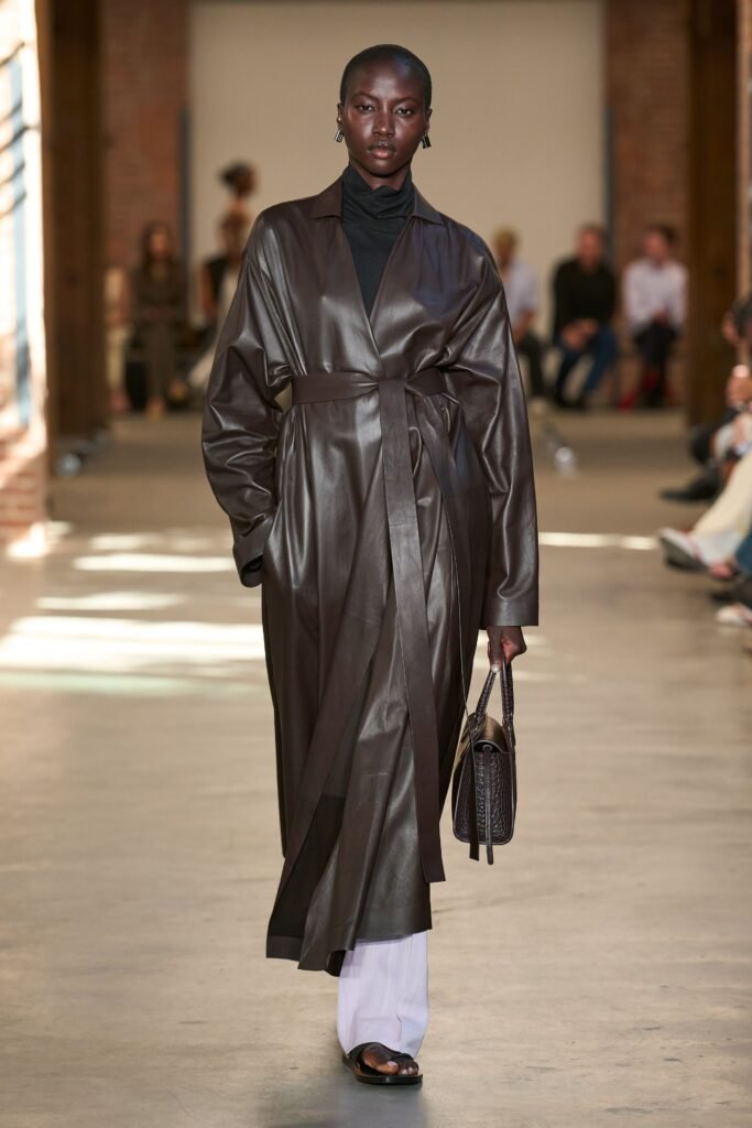 Image may contain Danai Gurira Clothing Coat Adult Person Standing Overcoat Footwear and Shoe