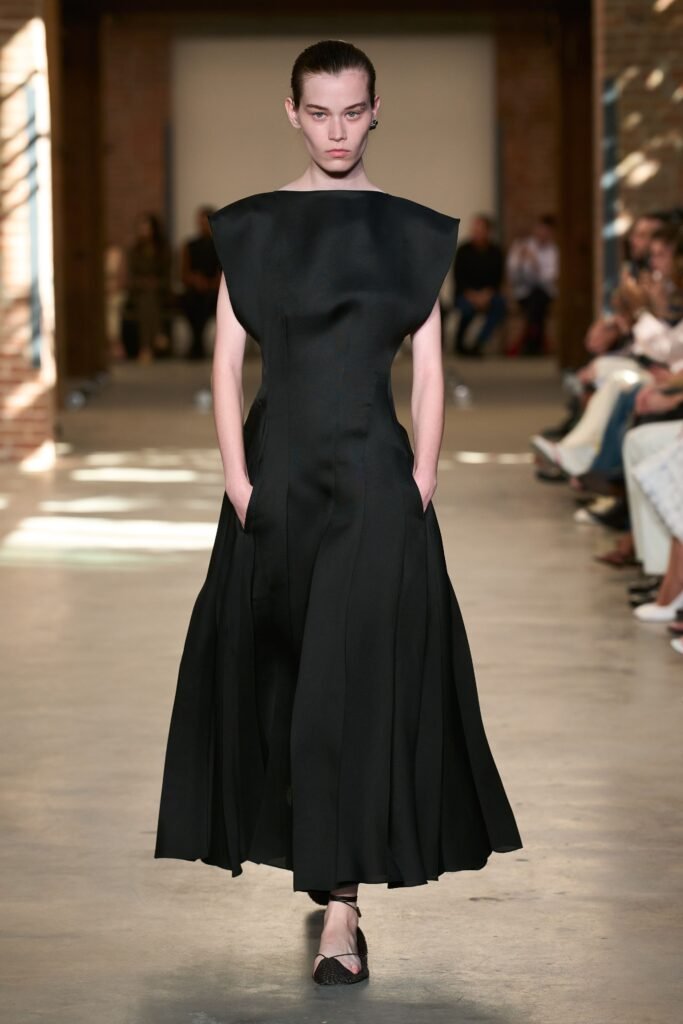 Image may contain Clothing Dress Fashion Formal Wear Evening Dress Adult Person and Gown