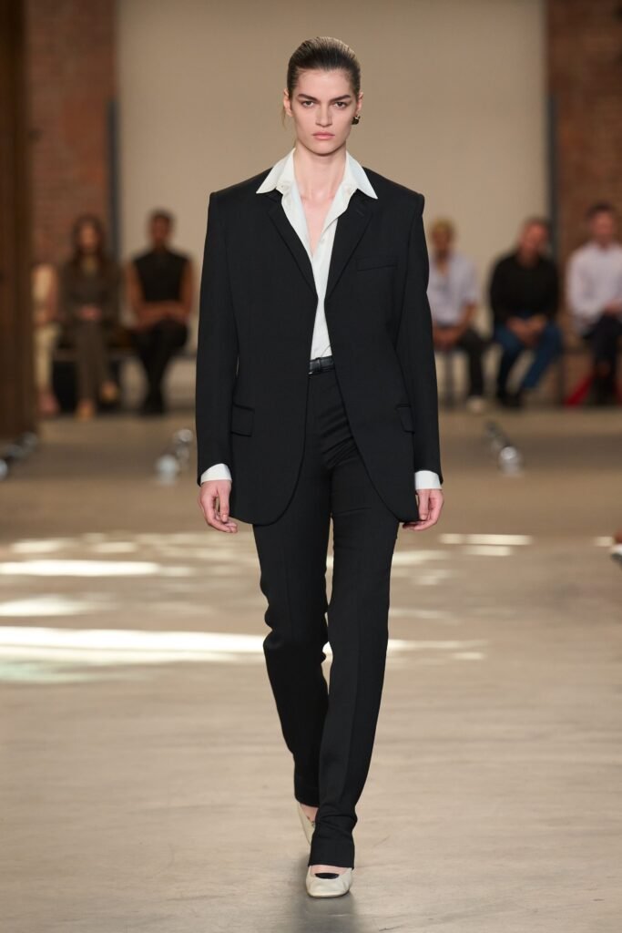 Image may contain Do Thi Hai Yen Clothing Formal Wear Suit Tuxedo Coat Jacket Adult Person and Blazer